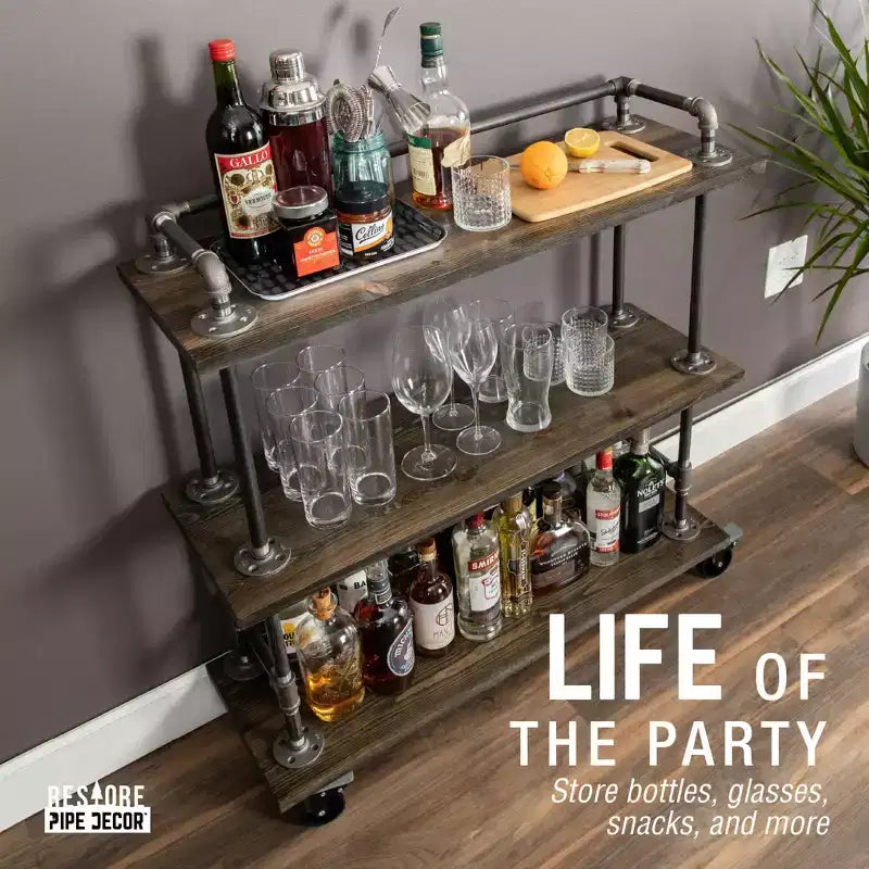 Carrello da bar industriale Pipe Decor a tre ripiani in legno con ruote bloccabili, Boulder Black