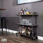 Carrello da bar industriale Pipe Decor a tre ripiani in legno con ruote bloccabili, Boulder Black