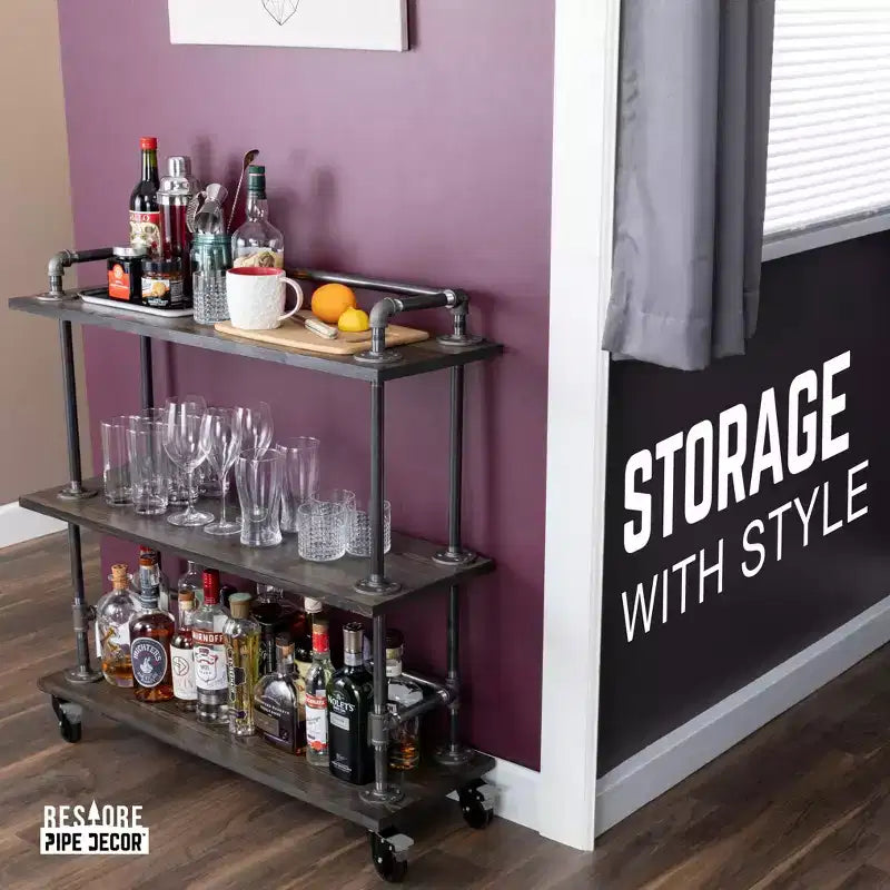 Carrello da bar industriale Pipe Decor a tre ripiani in legno con ruote bloccabili, Boulder Black