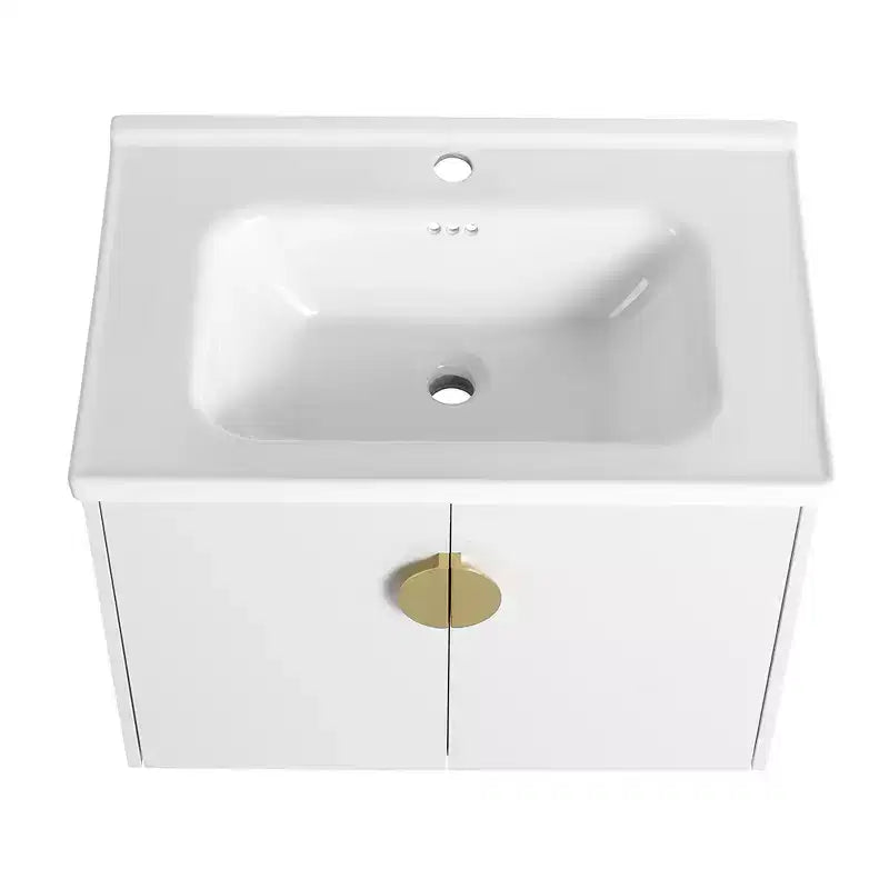 Mobile bagno moderno con lavabo in ceramica, ante con chiusura ammortizzata e finitura bianco lucido antigraffio.