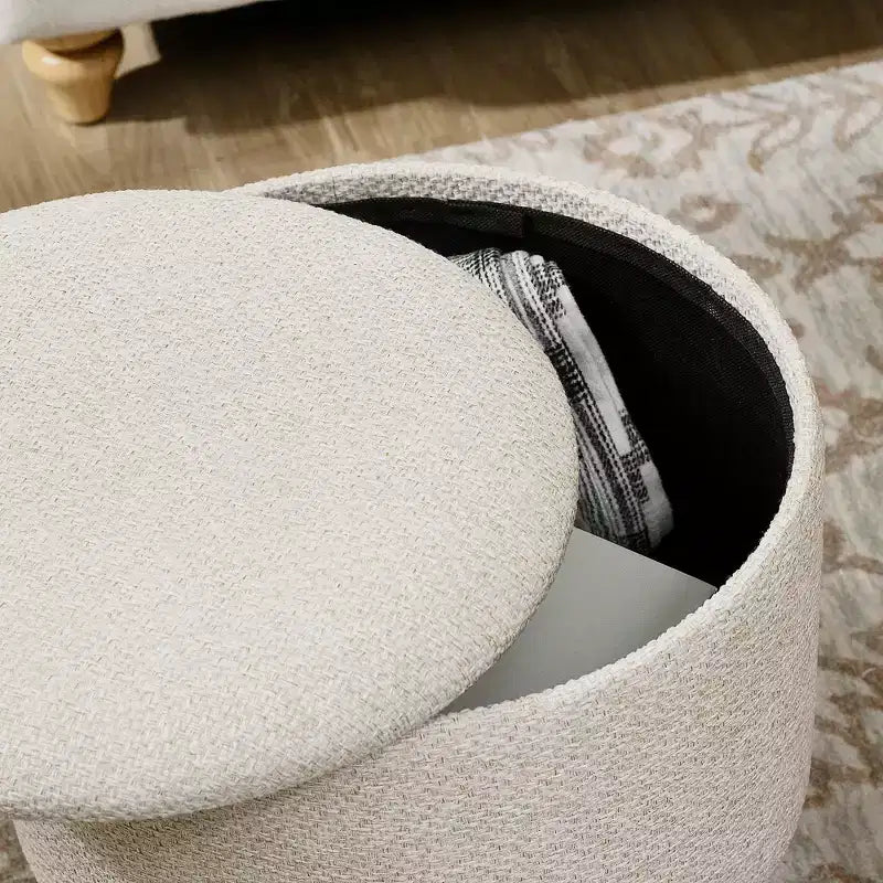 Poggiapiedi rotondo in lino imbottito con contenitore e seduta imbottita