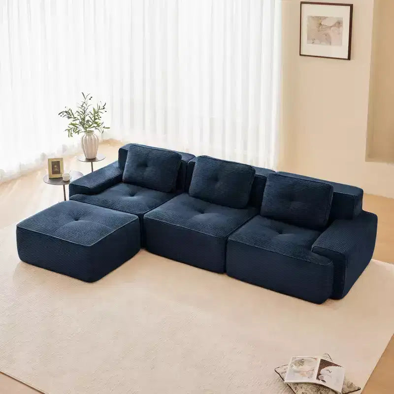 Divano componibile moderno a L 117 per soggiorno, in tessuto a coste, divano a 3 posti con seduta profonda e pouf mobile, color cammello